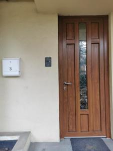 a wooden door on the side of a building at Angels' Whisper - Studio City Center in Braşov