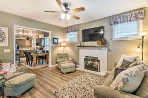 a living room with a couch and a fireplace at Remodeled Downtown Hot Springs Home with Porch! in Hot Springs