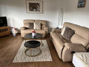 a living room with two couches and a coffee table at Ferienwohnungen Koch in Marburg an der Lahn