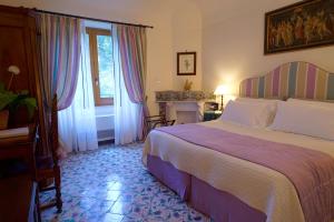 Postel nebo postele na pokoji v ubytování Hotel Villa Cimbrone