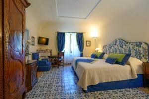 Postel nebo postele na pokoji v ubytování Hotel Villa Cimbrone