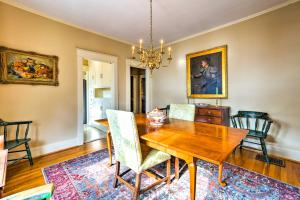 a dining room with a wooden table and chairs at The Green Door Lovely Apt-1 Block to DT Danville in Danville