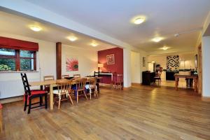 a dining room with a table and chairs at Betws Y Coed Serviced Holiday Home in Betws-y-coed