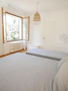 Кровать или кровати в номере La Cabane de la Mer