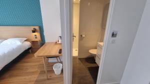 Postel nebo postele na pokoji v ubytování Oskar Hotel