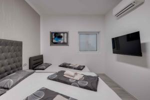 Televízia a/alebo spoločenská miestnosť v ubytovaní Crikvenica Apartment 18