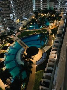 an overhead view of a large swimming pool at night at Kathys crib 32sqm Condo Shell Residences in Manila
