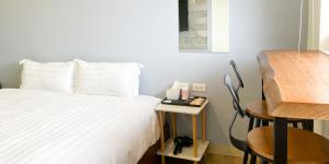 Katil atau katil-katil dalam bilik di Cen Pin B&B