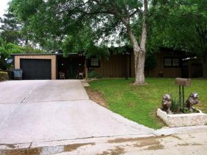 a house with a yard with a driveway at Home of the Brave 2 in Lawton