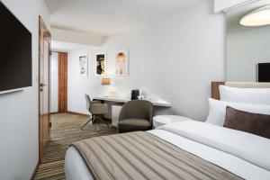 Postel nebo postele na pokoji v ubytování Leonardo Boutique Hotel Krakow City Center