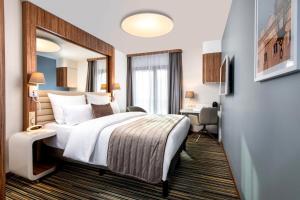 Postel nebo postele na pokoji v ubytování Leonardo Boutique Hotel Krakow City Center