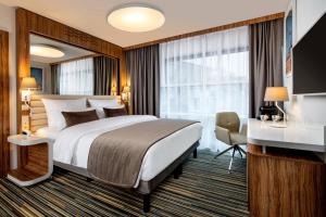 Postel nebo postele na pokoji v ubytování Leonardo Boutique Hotel Krakow City Center