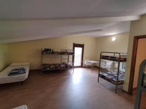Postel nebo postele na pokoji v ubytování Albergue Don Camino