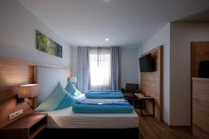 Postel nebo postele na pokoji v ubytování Landhotel Zum Jägerstöckl