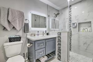 a white bathroom with a sink and a shower at Patio and Grill Spacious Gem Near Gulf Coast! in Brownsville +27 photos
