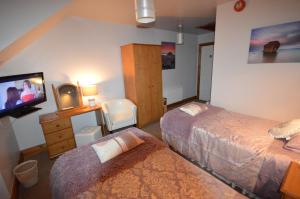 Ένα ή περισσότερα κρεβάτια σε δωμάτιο στο Crockatinney guest house
