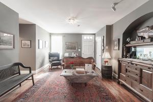 a living room with a couch and a table at Light Horse Inn in Harpers Ferry