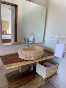 a bathroom with a sink and a mirror at Luana suites- Suite Koya in Zihuatanejo