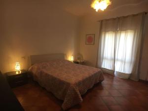 Ένα ή περισσότερα κρεβάτια σε δωμάτιο στο DESTE - In campagna 4 posti letto con giardino