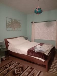 a bedroom with a bed and a window at The Little B&B on the Hill in Wadi Musa