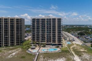 an aerial view of two tall buildings and a pool at Phoenix VIII by Brett Robins Vacations in Orange Beach