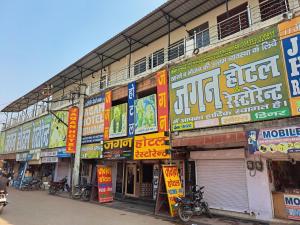 a bunch of signs on the side of a building at Jagan Hotel & Restaurant in Dhaulpur