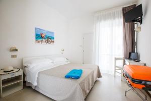 Postel nebo postele na pokoji v ubytování Hotel Capinera + 23 fotografií