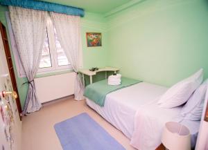 a bedroom with two beds and a window at Luxury Chez-Moi in Serres