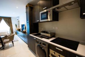 Kjøkken eller kjøkkenkrok på Splendid Apartments @ The Lennox