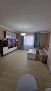 a living room with a couch and a tv at CASA LORY in Playa Blanca