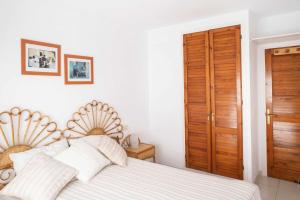 Postel nebo postele na pokoji v ubytování Les Pites I 2n 2a Bonito apartamento con terraza
