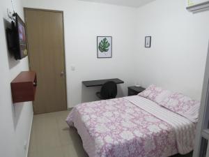 Postel nebo postele na pokoji v ubytování Espectacular y cómodo Apartamento en Girardot WiFi