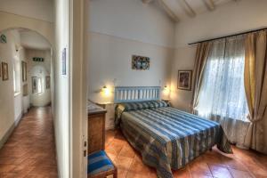 Кровать или кровати в номере Hotel Locanda Degli Artisti