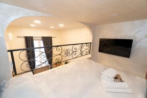Łóżko lub łóżka w pokoju w obiekcie POPOLO PEN 56 Apartament