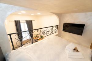 Łóżko lub łóżka w pokoju w obiekcie POPOLO PEN 56 Apartament