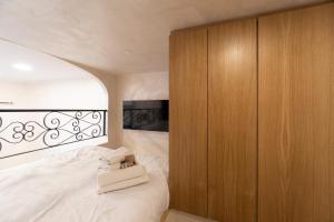 Łóżko lub łóżka w pokoju w obiekcie POPOLO PEN 56 Apartament