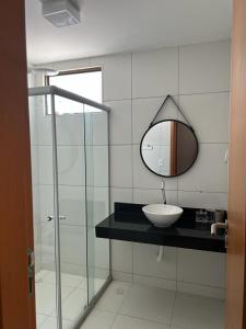 a bathroom with a sink and a mirror at ILOA RESORT - Barra de São Miguel in Barra de São Miguel