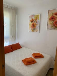 a bedroom with a bed with two towels on it at SUNBEACH SOLYMAR Bloque 73 Algarrobo Costa in Algarrobo-Costa +48 photos