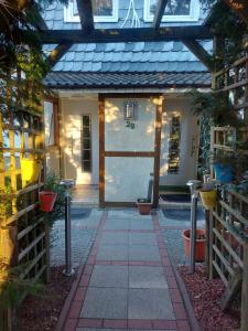 a front door of a house with plants in it at Ferienhaus Cissy in Lübeck