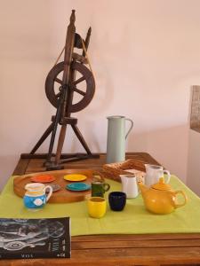 a table with a plate of food and a camera on it at Casa Vacanze Giulienso in Ardea