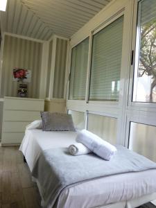 a bedroom with a large bed with a window at Jescamar 2 in Salou