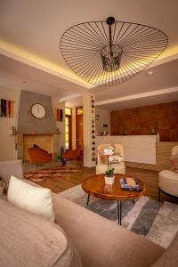 a living room with a couch and a table at Torre Dorada Cusco in Cusco