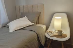 A bed or beds in a room at La Pausa