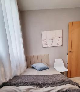 A bed or beds in a room at La Pausa