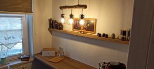 a kitchen with a shelf with some lights on it at FEWO Geborgenheit ASZA mit strahlungsfreien Zonen in Bautzen +65 photos