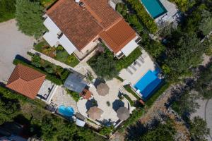 an overhead view of a house with a roof at Apartments House Barbara in Kornić