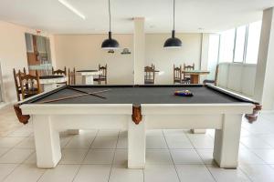 a pool table in the middle of a room at Samba Laguna Tourist Hotel in Laguna