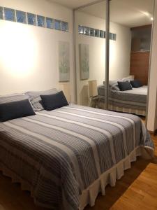 a large bed in a room with two beds at Amplio 2 ambientes en Belgrano! Gran ubicación! in Buenos Aires