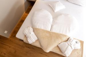 Postel nebo postele na pokoji v ubytování Vitalpina Hotel Magdalenahof