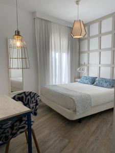 Łóżko lub łóżka w pokoju w obiekcie Hotel Boutique Teatro Romano